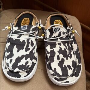 Hey Dude Women’s Slip Classic Black and White Cow Print